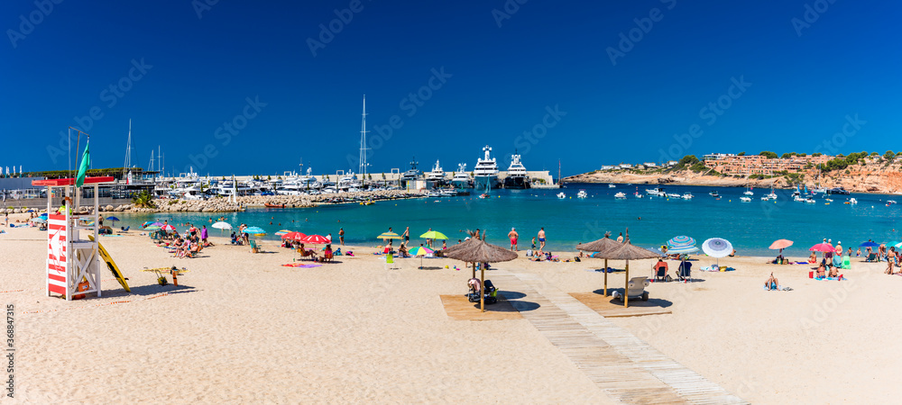 PORT ADRIANO, MALLORCA, SPAIN - 23 July 2020 - Tourists enjoying summer day on the city beach.