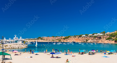 PORT ADRIANO, MALLORCA, SPAIN - 23 July 2020 - Tourists enjoying summer day on the city beach. © Martin Valigursky