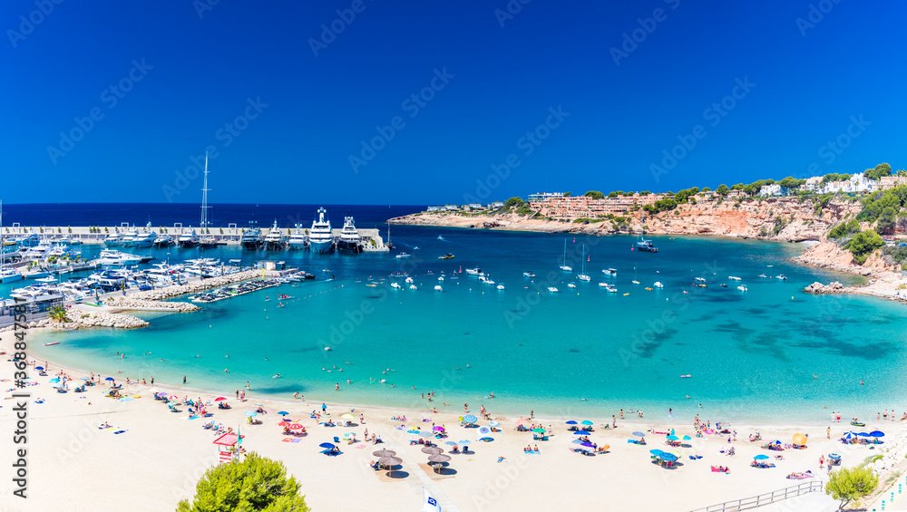 PORT ADRIANO, MALLORCA, SPAIN - 23 July 2020 - Tourists enjoying summer day on the city beach.