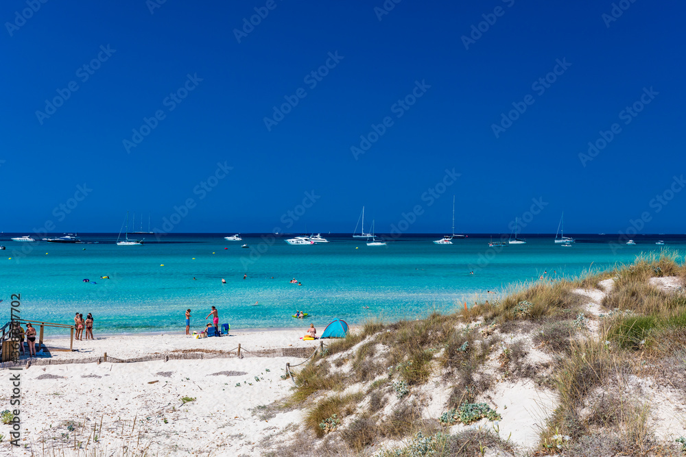 ES TRENC, Majorca, Spain - 25 JULY 2020 - People enjoying summer day on hotspot beach in Majorka.