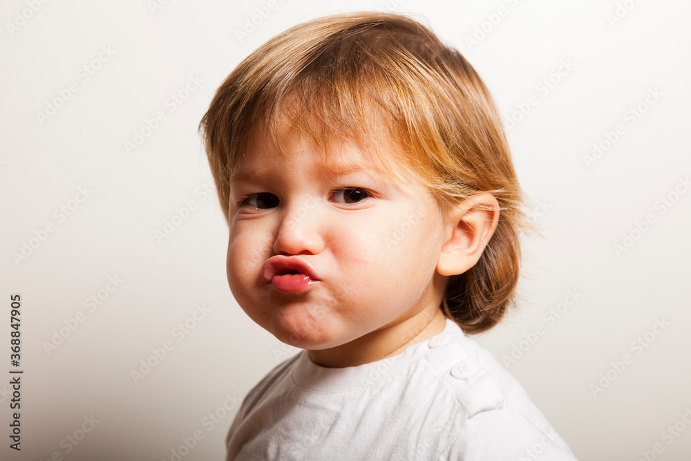 Portrait of a two years old boy grimaces Portrait of a two years old boy grimaces