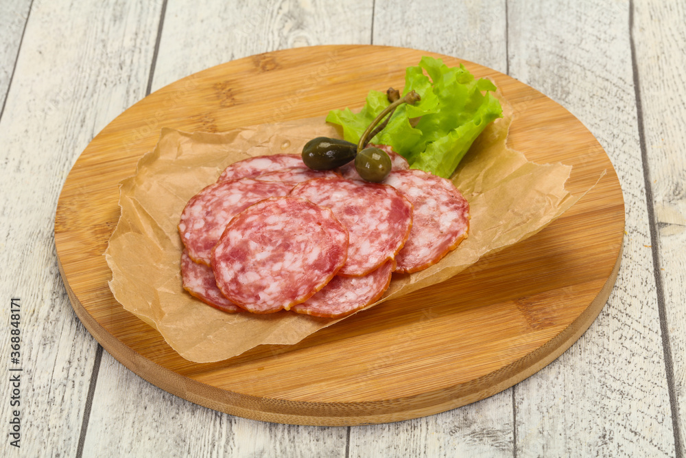Spanish Salchichon sausage with salad Spanish Salchichon sausage with salad