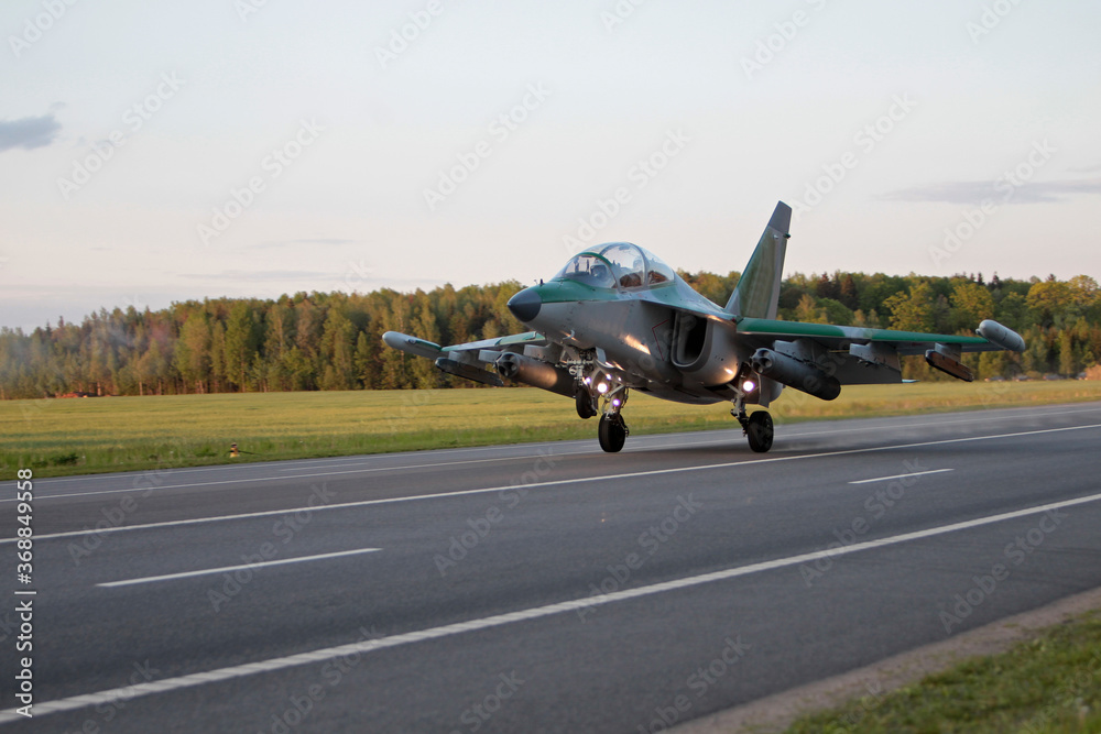 Yak-130 (NATO classification: Mitten) takes off from the airfield. Yak-130 (NATO classification: Mitten) takes off from the airfield.