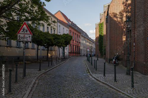 Empty sidewalk and street in old town in Düsseldorf, Germany.