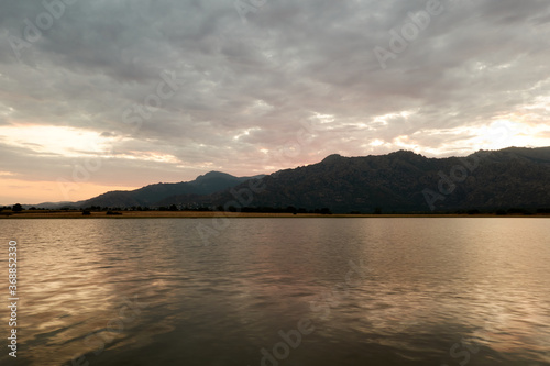 Sunset in the Santillana Reservoir with La Pedriza and the Sierra de Guadarrama in the background. Madrid s community. Spain