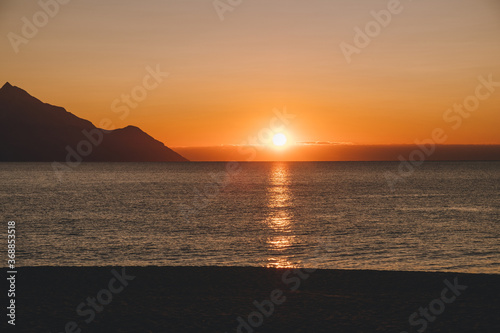 Beautiful morning sunrise at the empty beach © Boccabo