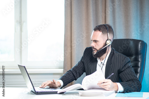 A focused man is working at...