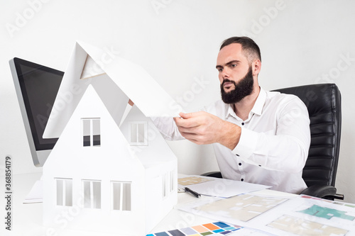 Architect at work. A man is...