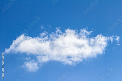 a single cloud in the blue sky  white cloud  sky with blue and white