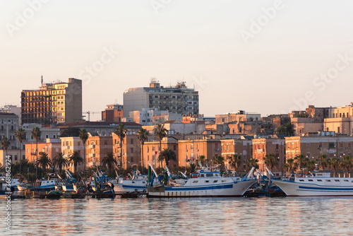 Sea port. Ships and boats at dawn. Sea town.