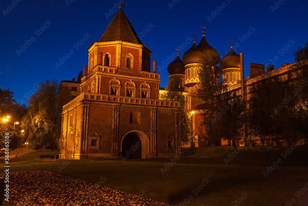 The Bridge Tower and the Intercession Cathedral with building light at night in the Izmaylovo Manor in Moscow, Russia