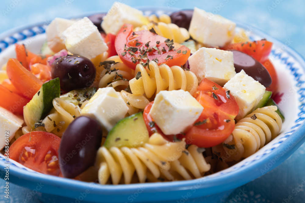 Cheese salad with pasta and fresh vegetables