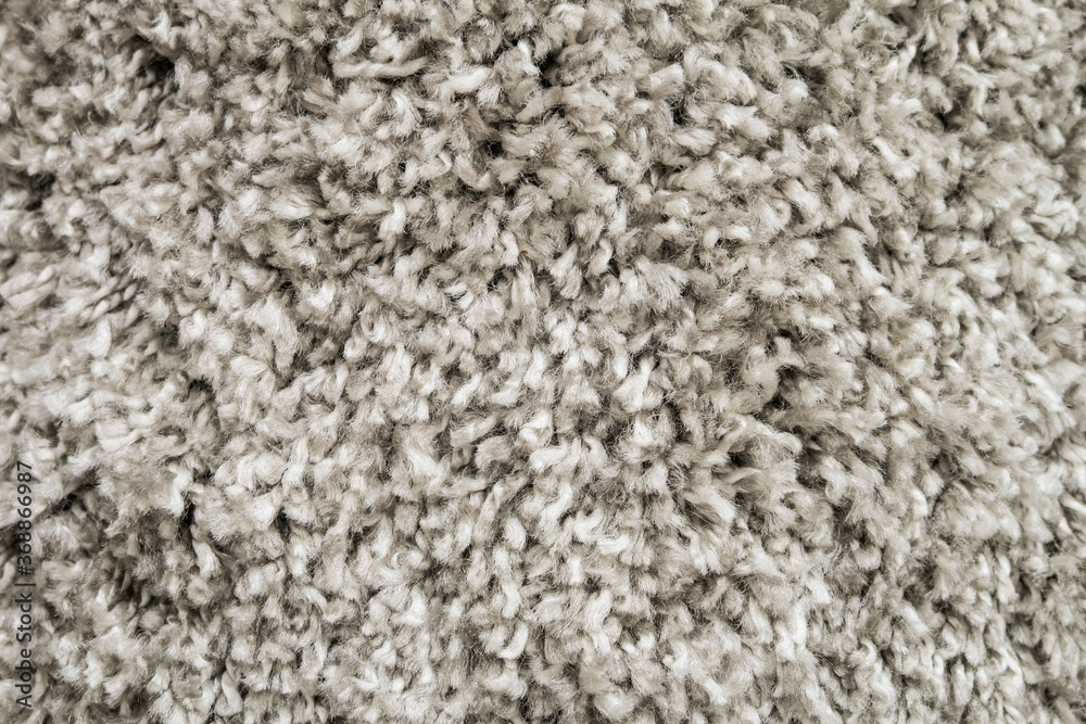 White wool carpet close-up. Soft loop pile surface. White wool carpet close-up. Soft loop pile surface.