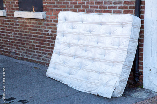 A mattress dumped or fly tipped in the street
