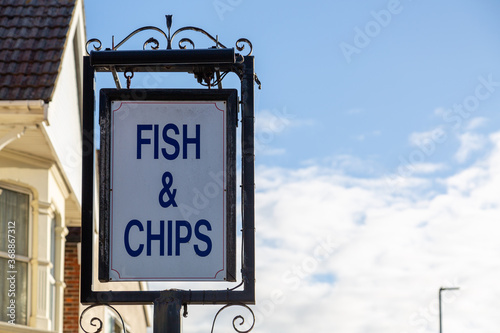 A sign outside a Fish and chips shop or chippy reading Fish and Chips