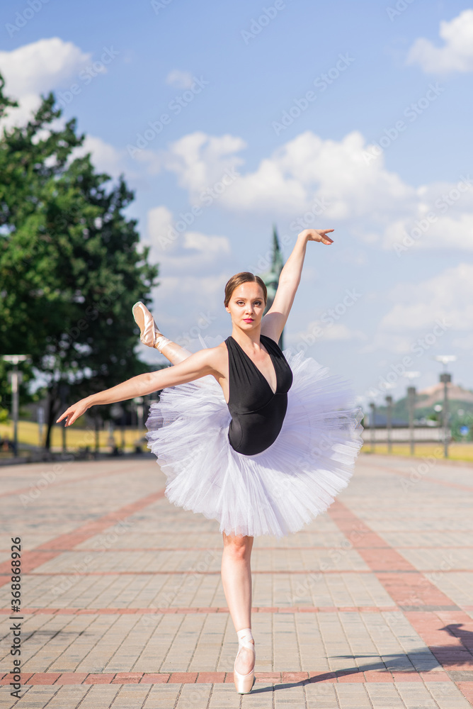 Young and beautiful ballerina posing on the street Young and beautiful ballerina posing on the street