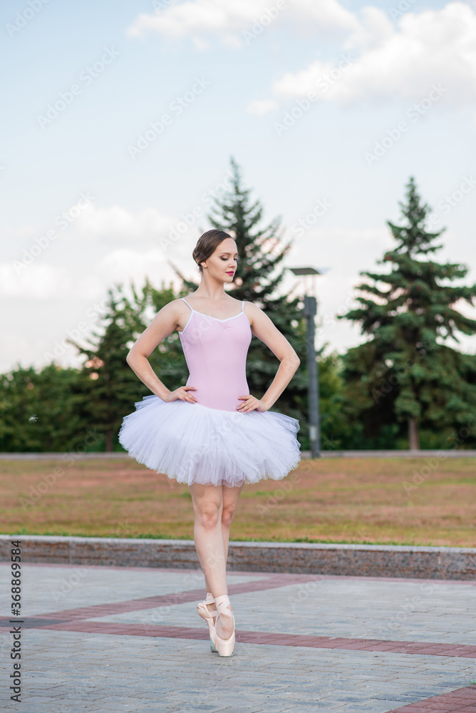 Young and beautiful ballerina posing on the street Young and beautiful ballerina posing on the street