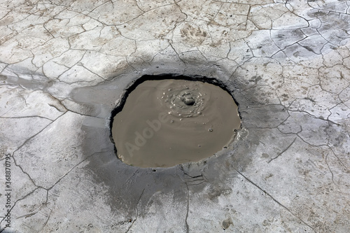 Mud geyser or mud volcano. Geological formation hydrogeological photo