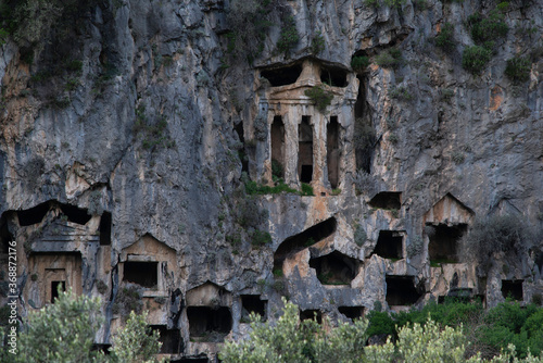 The king tombs on the hills of Kaunos ancient city, Mugla, Turkey photo