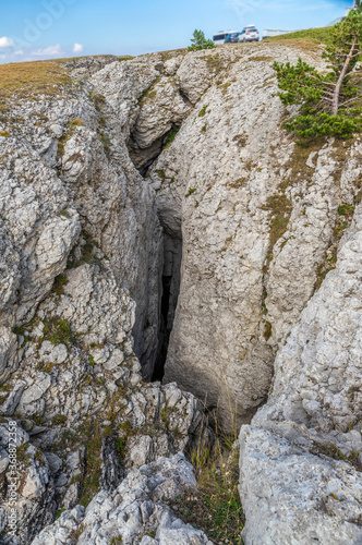 The karstic cavity on the Gurzuf Yaila plateau in the Crimean nature reserve. HDR image. Republic of Crimea. photo