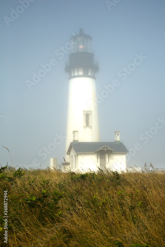 Yaquina Head Lighthouse in the fog, Newport, Oregon