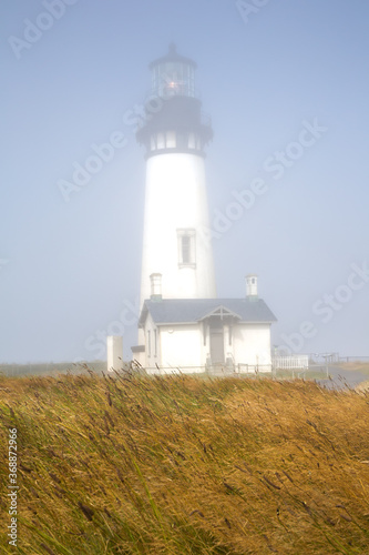 Yaquina Head Lighthouse in the fog, Newport, Oregon