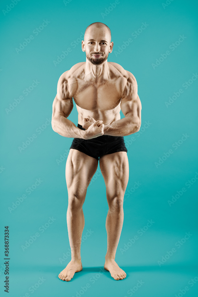 male bodybuilder posing like a champion isolated with extreme muscles male bodybuilder posing like a champion isolated with extreme muscles