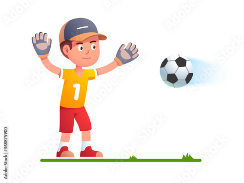 Goalkeeper boy kid trying to catch soccer football