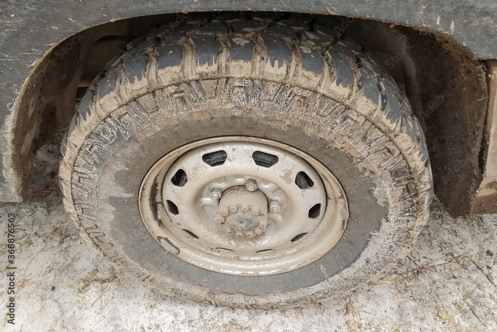 SUV wheel is smeared with mud