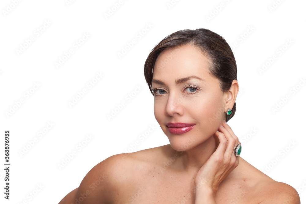 Beautiful young woman wearing jewels made with Colombian Emeralds isolated on white background Beautiful young woman wearing jewels made with Colombian Emeralds isolated on white background