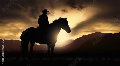 Cowboy on a horse at sunset © ginettigino