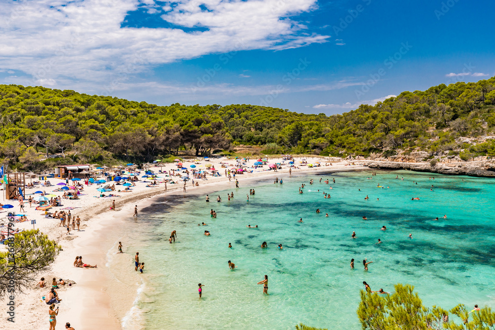 CALA MONDRAGO, Majorka, Spain, 24 July 2020 - People enjoy the beach in ...