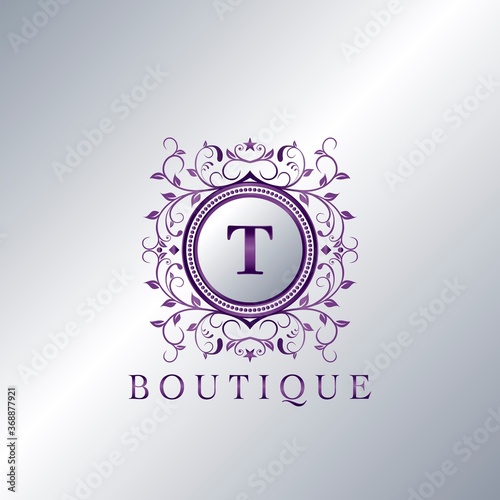 Modern Luxury Boutique Letter T logo. Unique elegance design floral ornament with purple metal circle frame vector design.