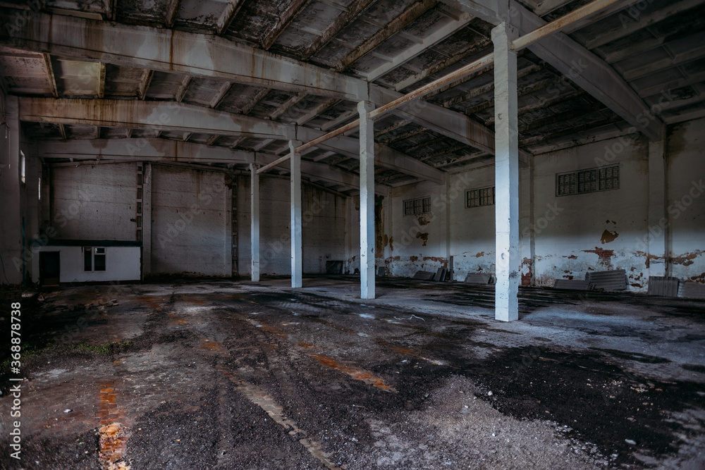 Old broken empty abandoned industrial building interior