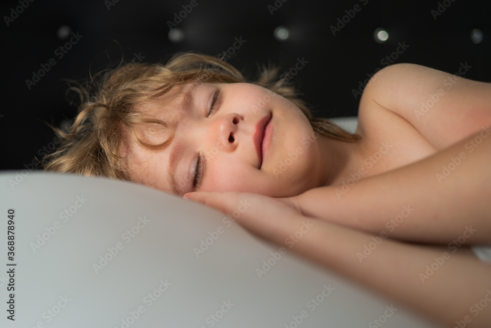 Smiling kids sleeping in bed. Sweet dreams. White pillow. Little angel dreams. Smiling kids sleeping in bed. Sweet dreams. White pillow. Little angel dreams.