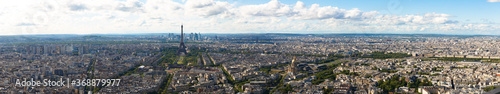 Photography Panoramic view of Paris, including the Eiffel Tower, as seen from the top of Mon