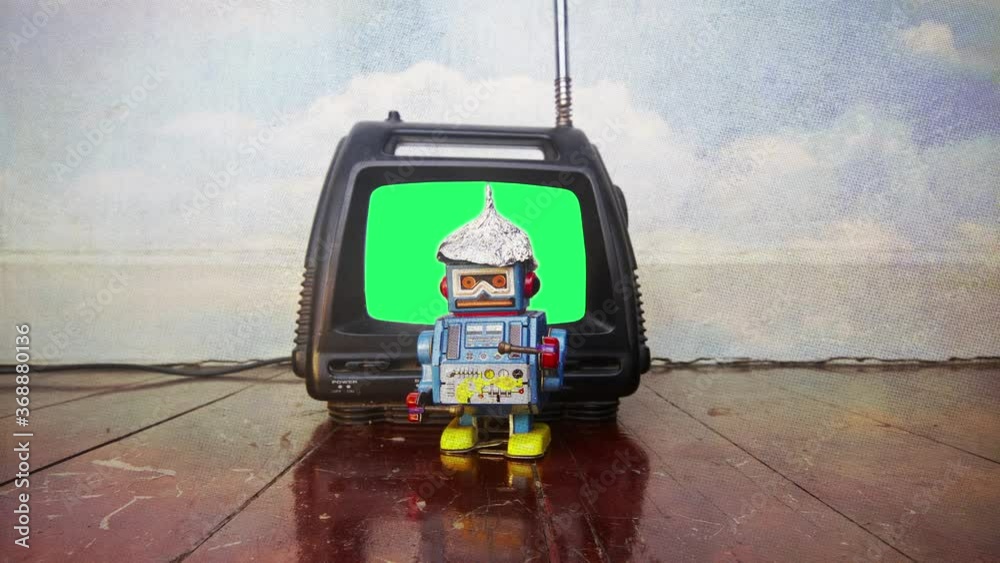 little tin bot wit his foil hat watching TV green screen little tin bot wit his foil hat watching TV green screen