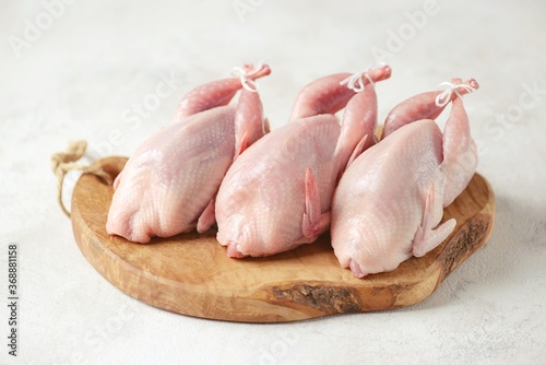 Fresh raw quail on a light background. Organic food.