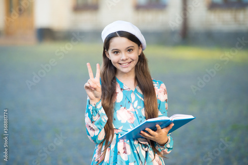 Girl student inspired reading recite poetry, having fun concept photo