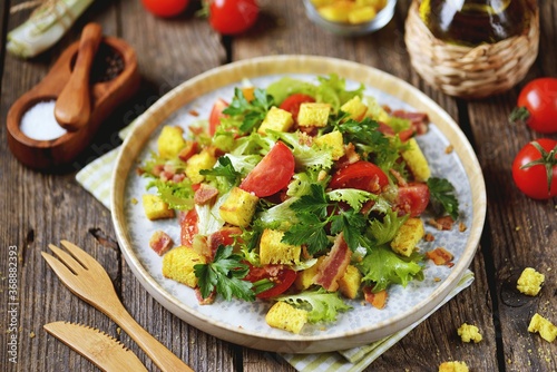 Cherry tomato salad, lettuce, with fried bacon, corn croutons with olive oil and white balsamic.