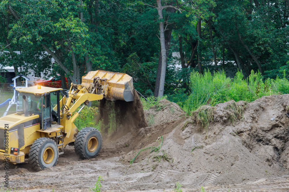 Bulldozer landscaping works on construction working with earth while doing Bulldozer landscaping works on construction working with earth while doing