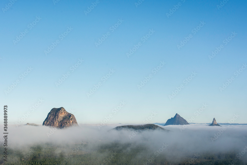 Early morning mist over the Glasshouse Mountains, Sunshine Coast Hinterland, Queensland, Australia. taken from Wildhorse Mountain