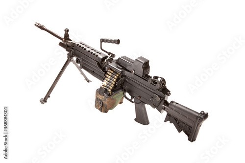 M249 SAW squad automatic weapon with a camouflage ammo pouch, shot in studio. photo