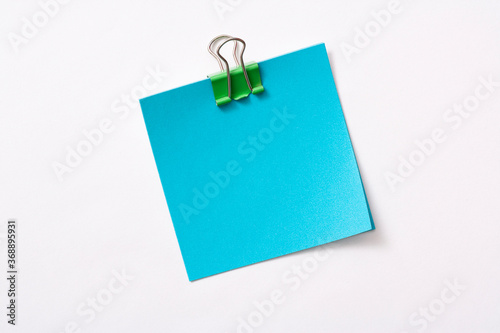 note paper and clip isolated on white background 