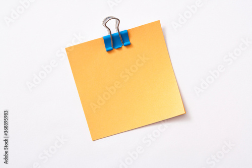 note paper and clip isolated on white background
