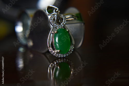 Gemstones jewelery Is a pendant necklace decorated with green jade