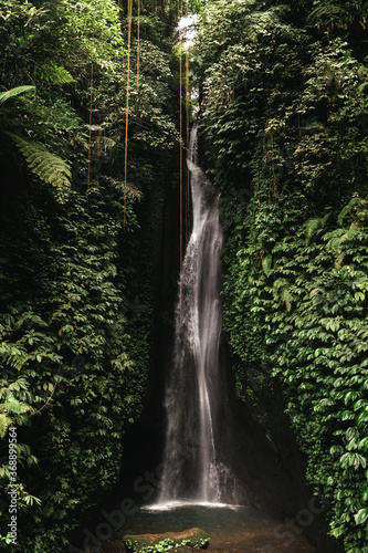 Beautiful waterfall in tropical rainforest. Jungle river.