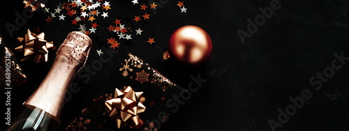 Christmas background banner  with bottle of champagne , gold  decorations, st...