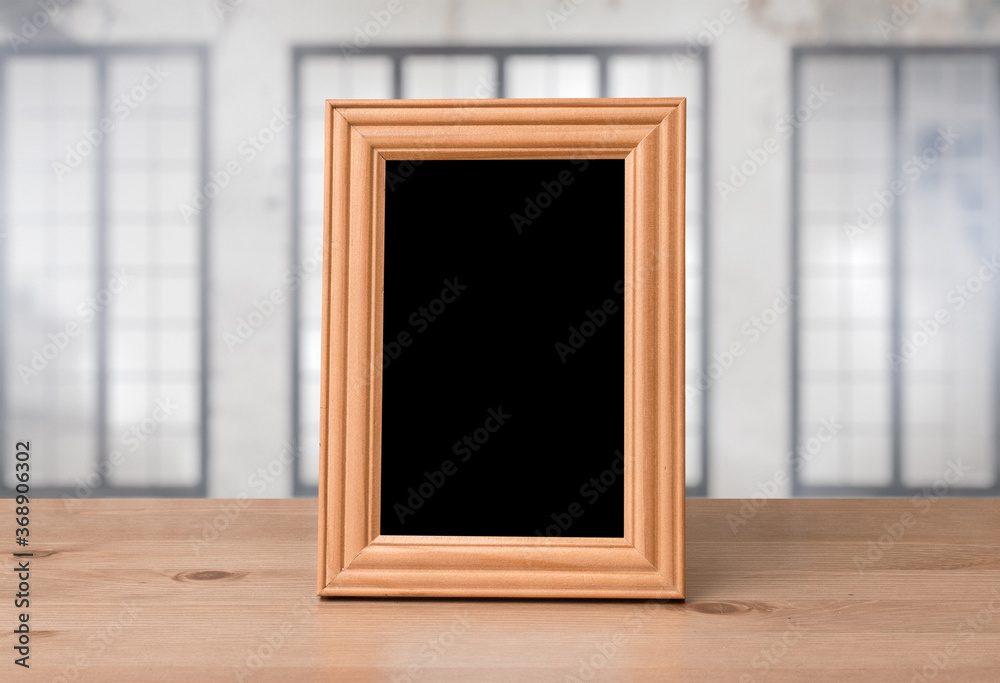old photo frame on the wooden table - obrazy, fototapety, plakaty 
