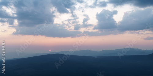 Pink sunrise panorama over the mountains